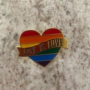 Rainbow heart pin. Pride pin. LGBTQ. Love is love. About 1 1/2 in across.